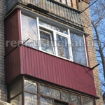 Фото. Обшивка балкона с наружной стороны профлистом. Цвет красный. Кривой Рог